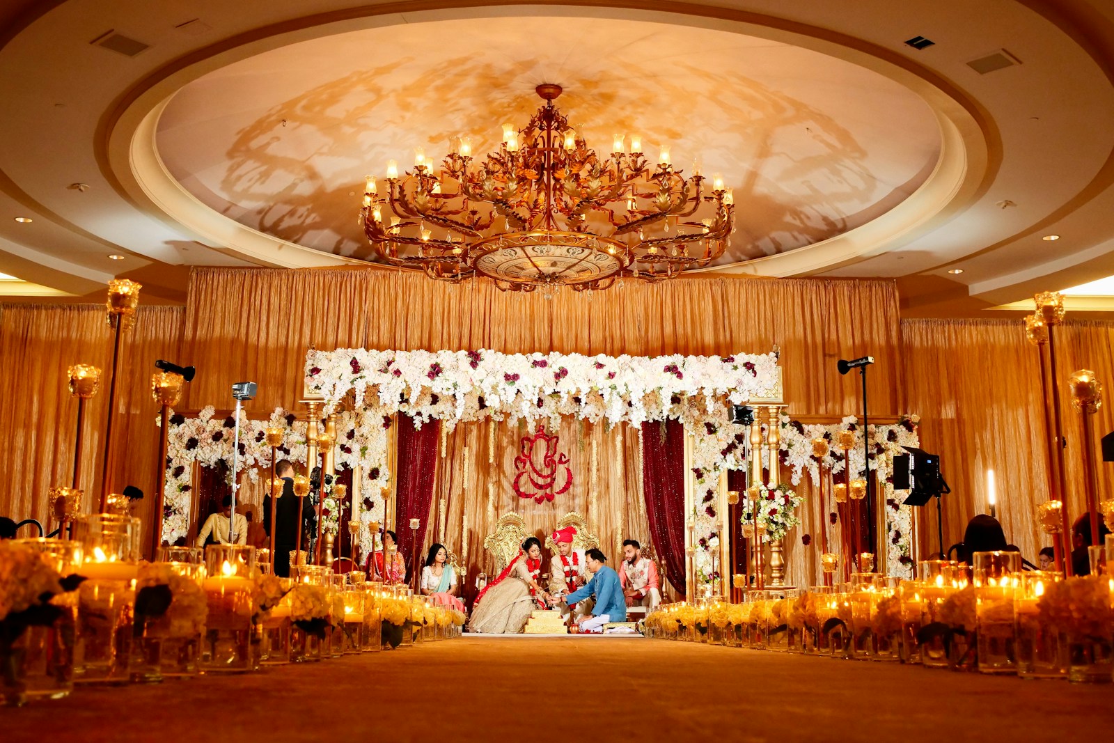 Grand Indian wedding reception with floral ceiling